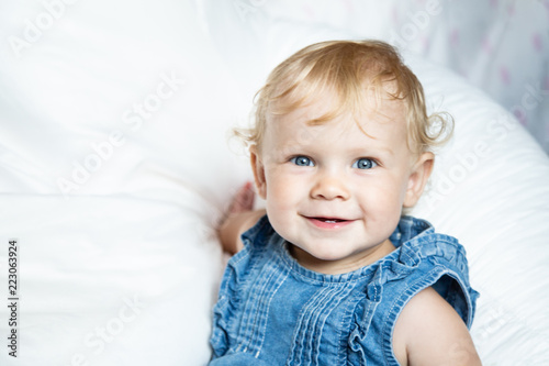 Close Up Portrait Of A Cute Baby Girl With Big Beautiful Blue Eyes