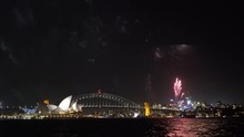 4k UHD Cinematic Establishing Shot Of Night Scene With Fireworks Show At Sydney City Skyline.
