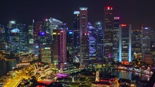 SINGAPORE - OCT 19, 2017: Fantastic Night View Of Singapore City Center With Beautiful Historical Buildings Illuminated By Colorful Lights Against River And Marina Bay Financial Centre On Background.
