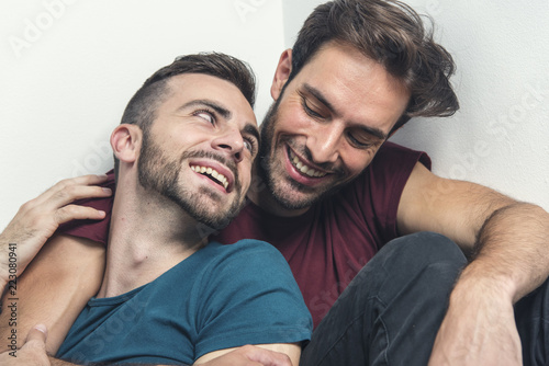 Happy gay couple embraced, joking and having fun in an intimate hug Tapéta, Fotótapéta