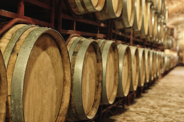 Canvas Print - Large wooden barrels in wine cellar, closeup