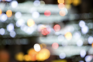 Wall Mural - Blurry background image of defocused colorful lights at night