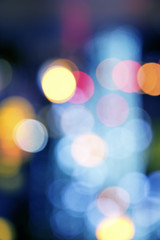 Wall Mural - Blurry background image of defocused colorful lights at night