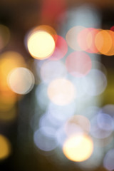 Wall Mural - Blurry background image of defocused colorful lights at night
