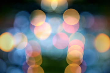 Wall Mural - Blurry background image of defocused colorful lights at night