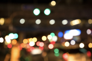 Wall Mural - Blurry background image of defocused colorful lights at night