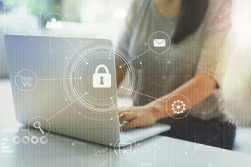 Cyber security with woman using her laptop in a living room
