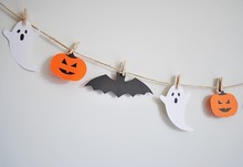 Halloween Paper Garland With Ghost, Pumpkin And Bat Hanging On The Wall. Easy Crafts For Kids.