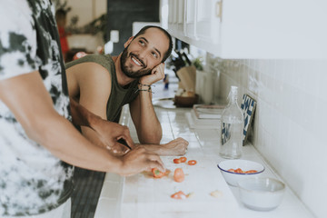 Gay couple cooking in the morning