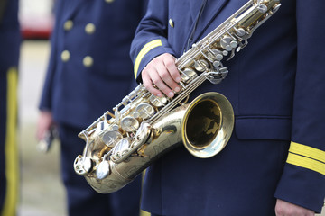 Details of a man holding a saxophone