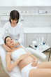 © puhhha - Face Cosmetology. Facial Massage For Pregnant Woman At Clinic