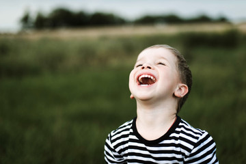 Wall Mural - portrait of a young boy outdoors