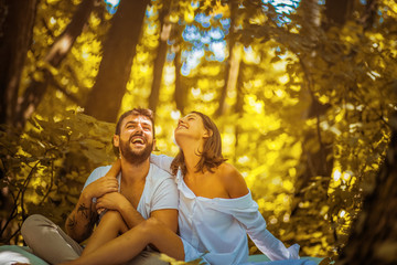 Portrait of young happy couple in nature.