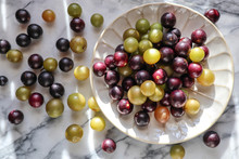 Muscato Muscadine Sweet Green Bronze And Purple Black Grape On White Marble Board