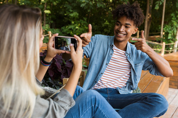 Wall Mural - Excited young multiethninc couple spending time