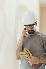 Wall Mural - Professional builder working and having a phone call