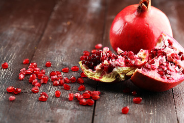 Wall Mural - Ripe and juicy pomegranate. Red organic pomegranate.