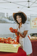 © Rawpixel.com - Woman buying tomatoes at a farmers market