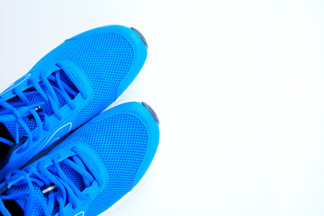 Wall Mural - blue running shoes for men on a white background