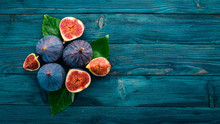 Fig. Fresh Fruit Figs On A Blue Wooden Table. Free Space For Text. Top View.