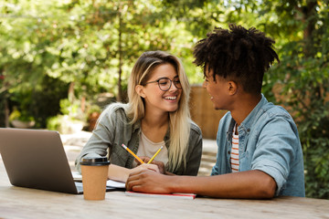 Wall Mural - Excited young multiethnic couple spending time together