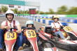 © Tom Wang - happy family driving go kart on the track