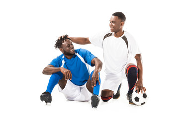 Wall Mural - happy african american soccer players having fun isolated on white