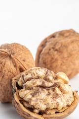 Poster - large walnuts on white background