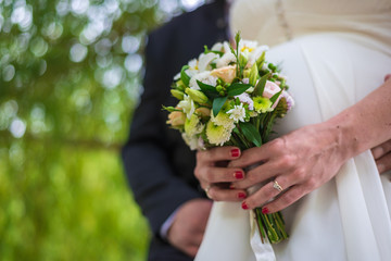 Wall Mural - wedding bouquet in the hands of the bride