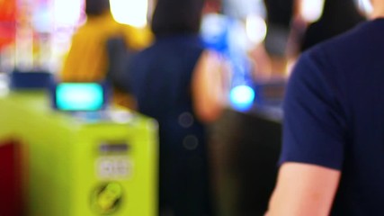 Canvas Print - blurred landscape view of sky train ticket gate with people passed by in the rush hour 