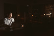 © mavoimages - Young Asian businessman working late at night in an office