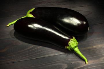 Poster - Eggplants on a dark background