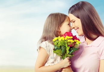 Poster - Portrait of happy mother and daughter holding