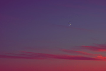 Wall Mural - sunset half moon pink clouds.