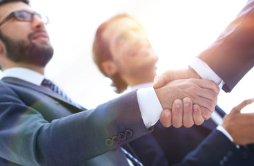 Cropped image of business people shaking hands