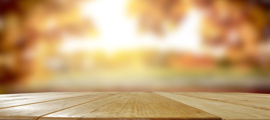 Poster - Autumnal wooden table with space for an advertising product  