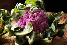 Colorful Cauliflower Cabbages On Table. Healthy Food.