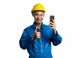 © Phushutter - Headshot of engineer young man using mobile phone Asian man.
