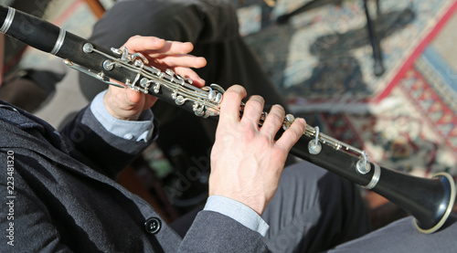 Obraz Dibond Musician plays the flute in the orchestra
