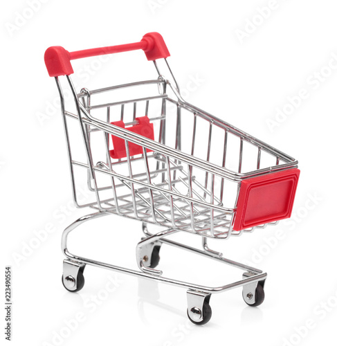 Fotografía a small shopping cart isolated on white background
