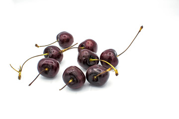 Ripe red fresh cherry on a white isolated background.