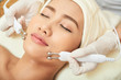 © DragonImages - Attractive young woman enjoying microcurrent procedure in spa salon