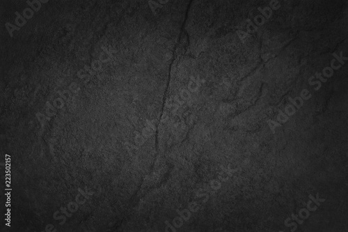 Fototapeta Dark grey black slate texture in natural pattern with high resolution for background and design art work. Black stone wall.