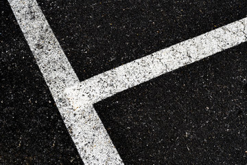 Grey with white line angle on the road and small rock, high angle view dirty white line on surface of old asphalt in countryside, Top view