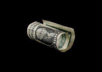 One dollar bill isolated on black background