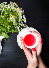 Wall Mural - Female having a herbal tea first person