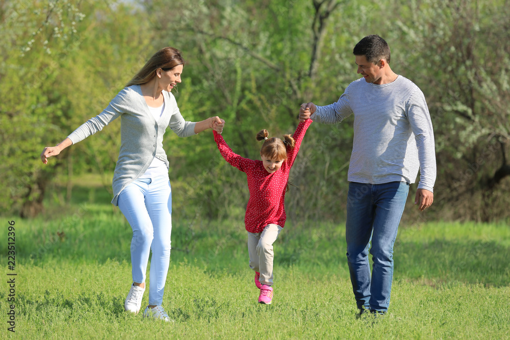 Happy family in park on sunny day