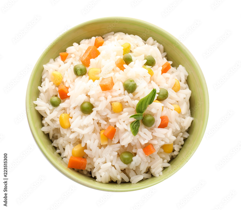 Bowl with tasty boiled rice and vegetables on white background