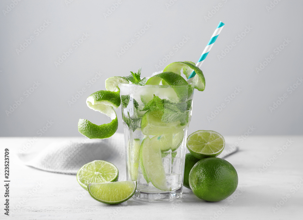 Glass of fresh mojito on light table