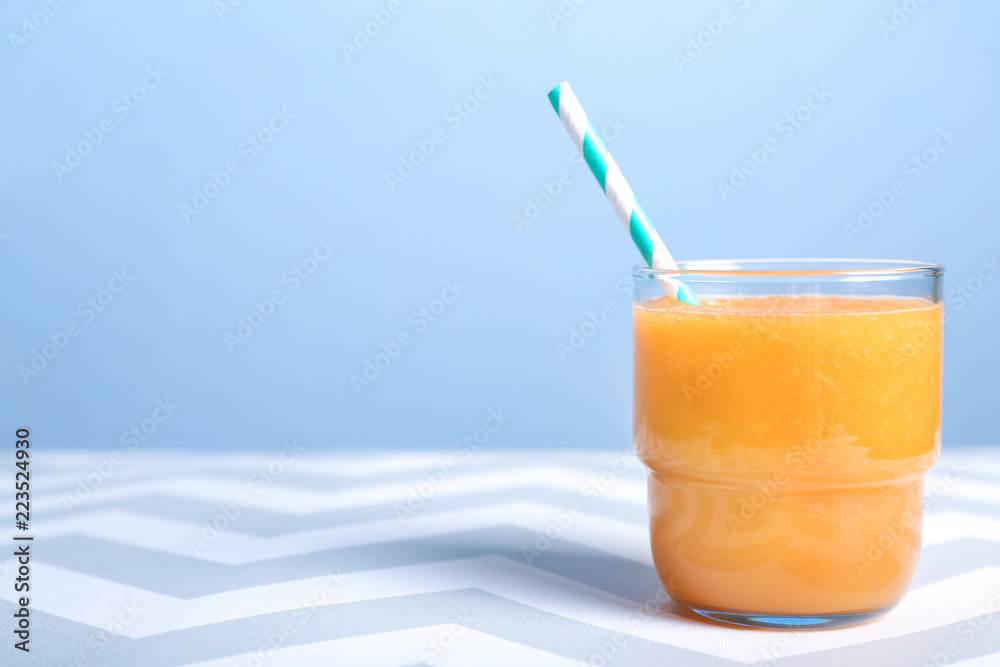 Glass of tasty melon smoothie on table